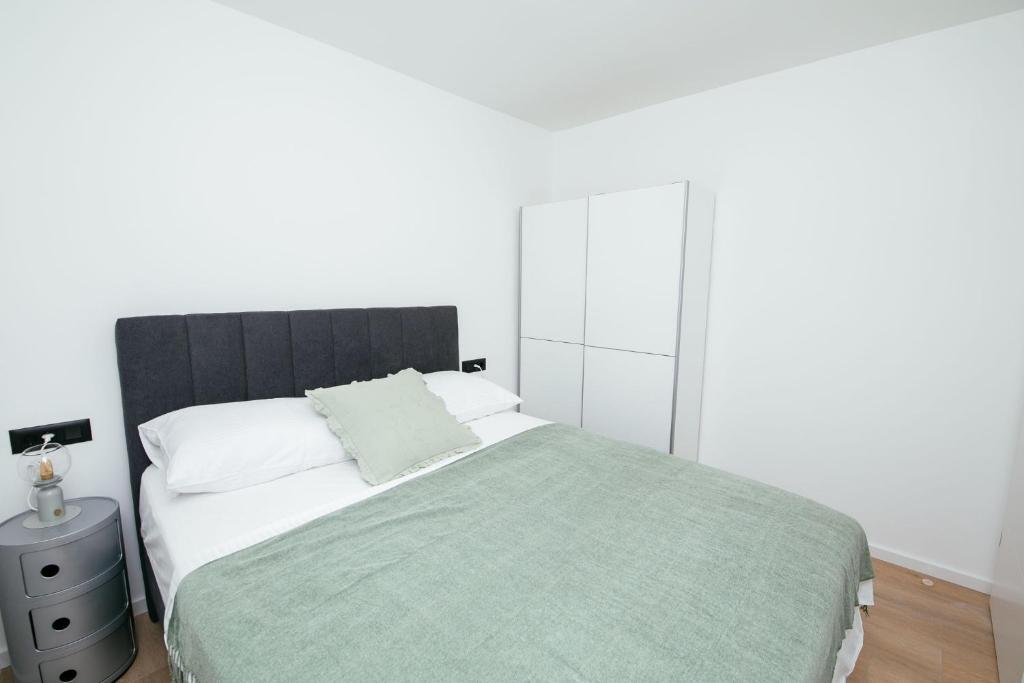 Posteľ alebo postele v izbe v ubytovaní DiDixi Apartments