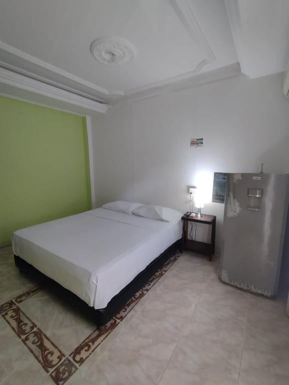 Postel nebo postele na pokoji v ubytování La fantástica Mi Hostal
