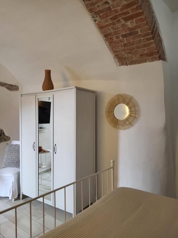 A bed or beds in a room at Affittacamere Il Timone
