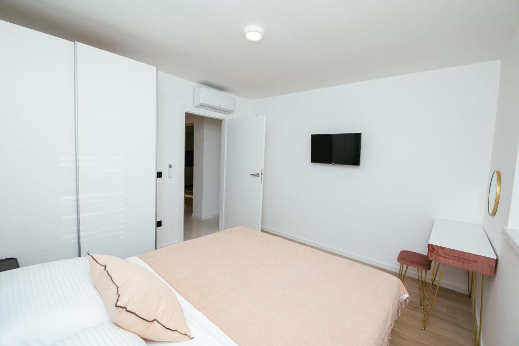 Posteľ alebo postele v izbe v ubytovaní DiDixi Apartments