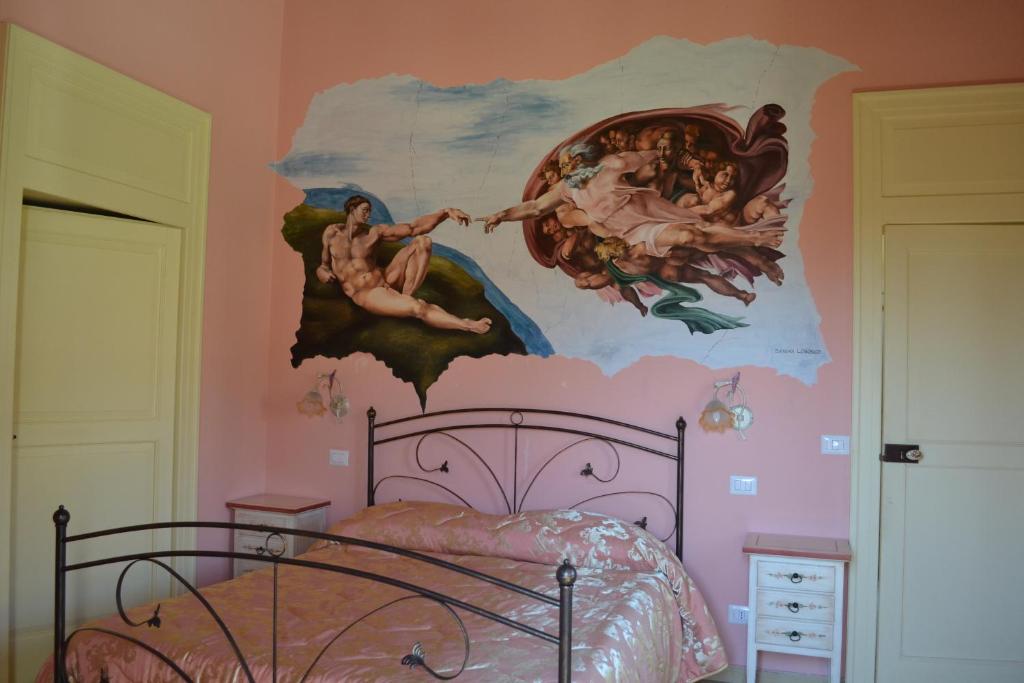 Postel nebo postele na pokoji v ubytování Agriturismo La Palazza