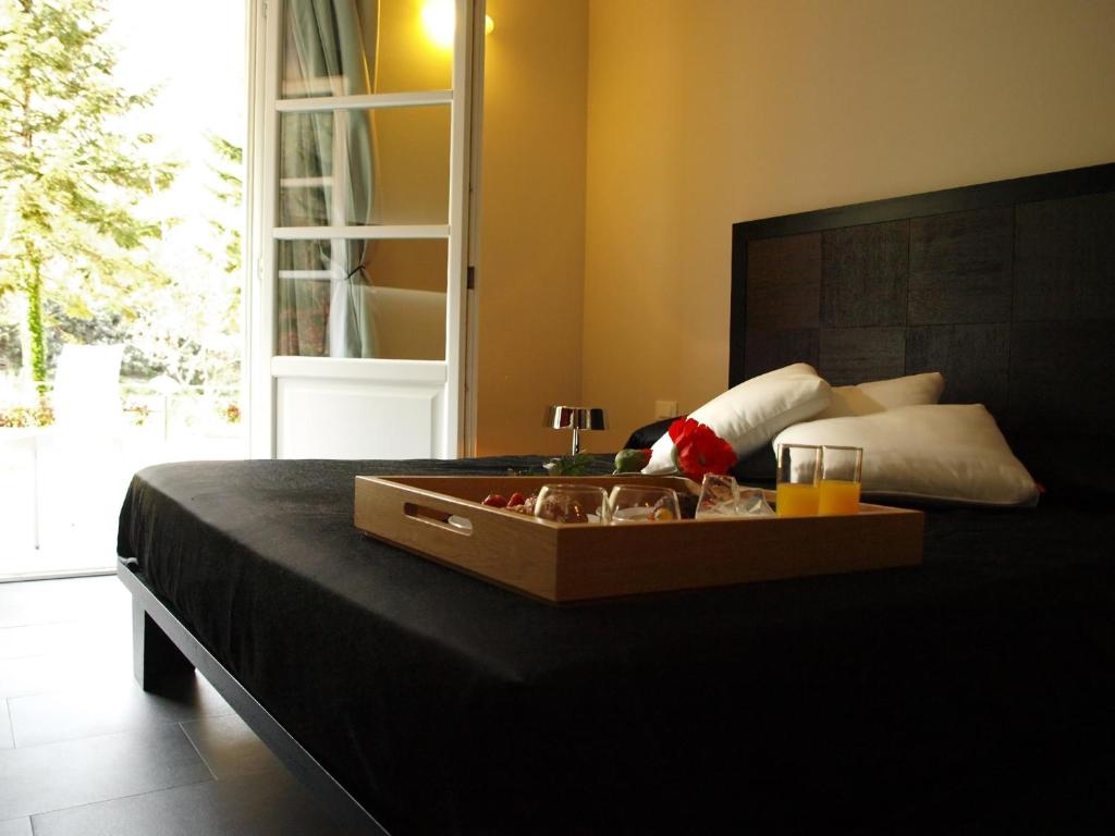 A bed or beds in a room at Hotel Abetaia