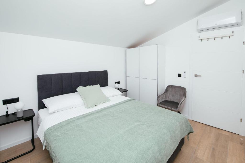 Posteľ alebo postele v izbe v ubytovaní DiDixi Apartments