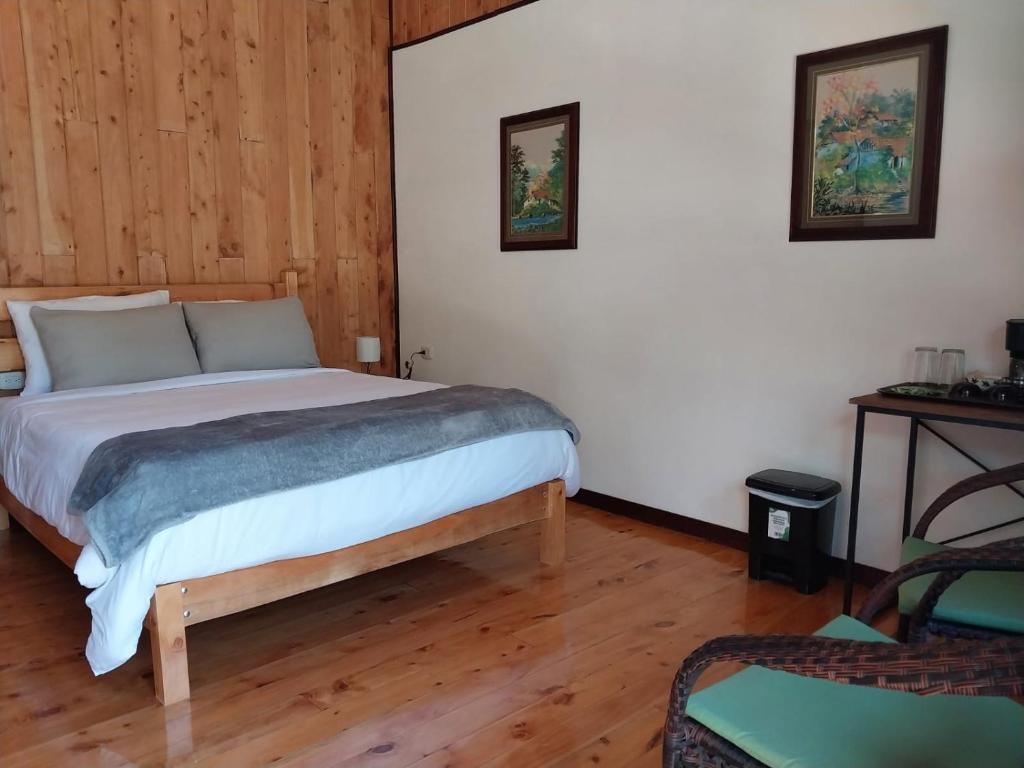 Postel nebo postele na pokoji v ubytování Curuba Lodge