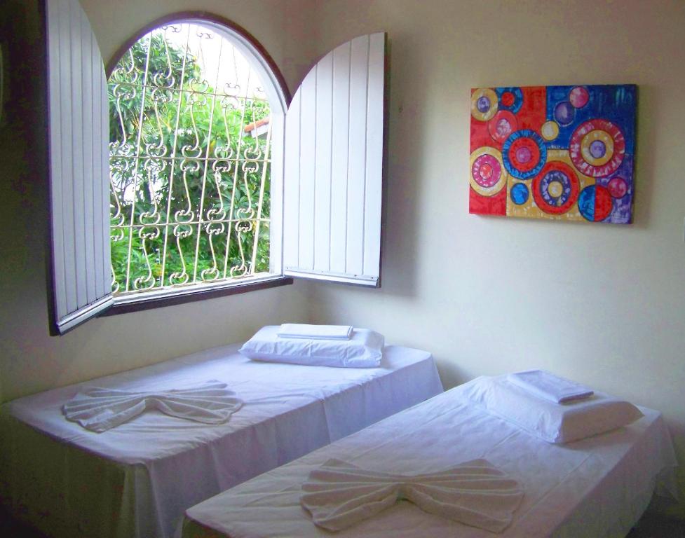 Postel nebo postele na pokoji v ubytování Cosmopolitan Hostel