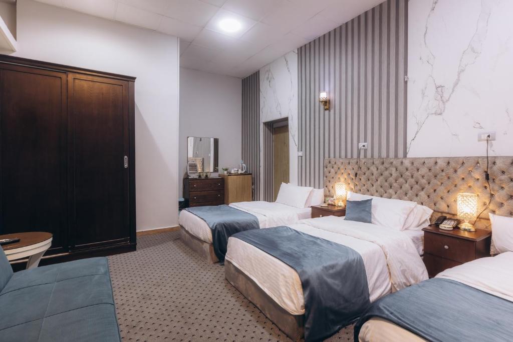 Postel nebo postele na pokoji v ubytování El Tahrir View Hotel