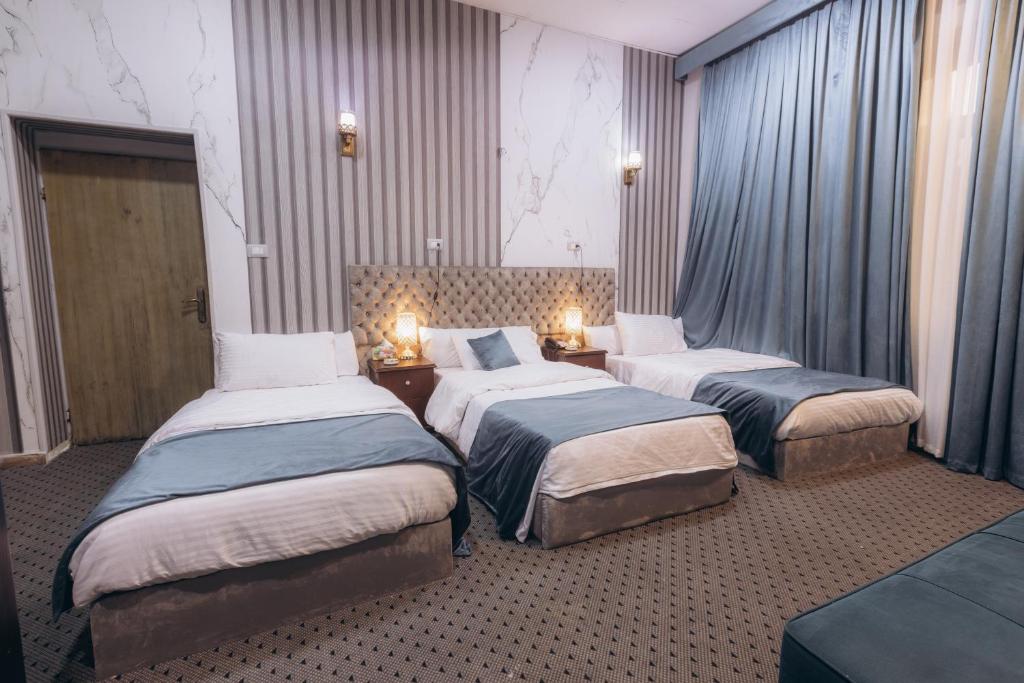 Postel nebo postele na pokoji v ubytování El Tahrir View Hotel