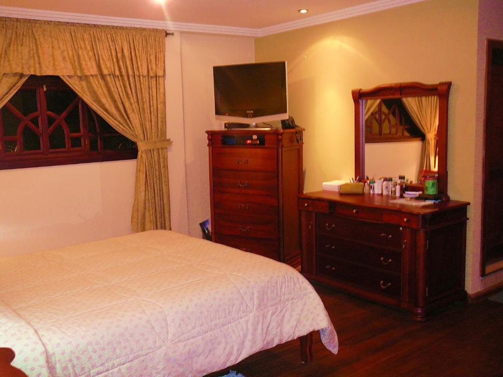 Postel nebo postele na pokoji v ubytování Hotel Coronel