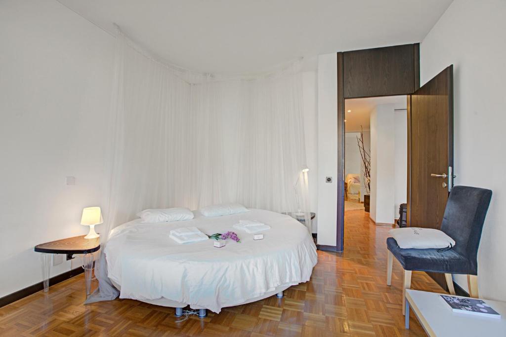 Postel nebo postele na pokoji v ubytování Lugano Luxury - Happy Rentals