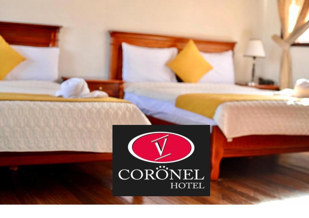 Postel nebo postele na pokoji v ubytování Hotel Coronel