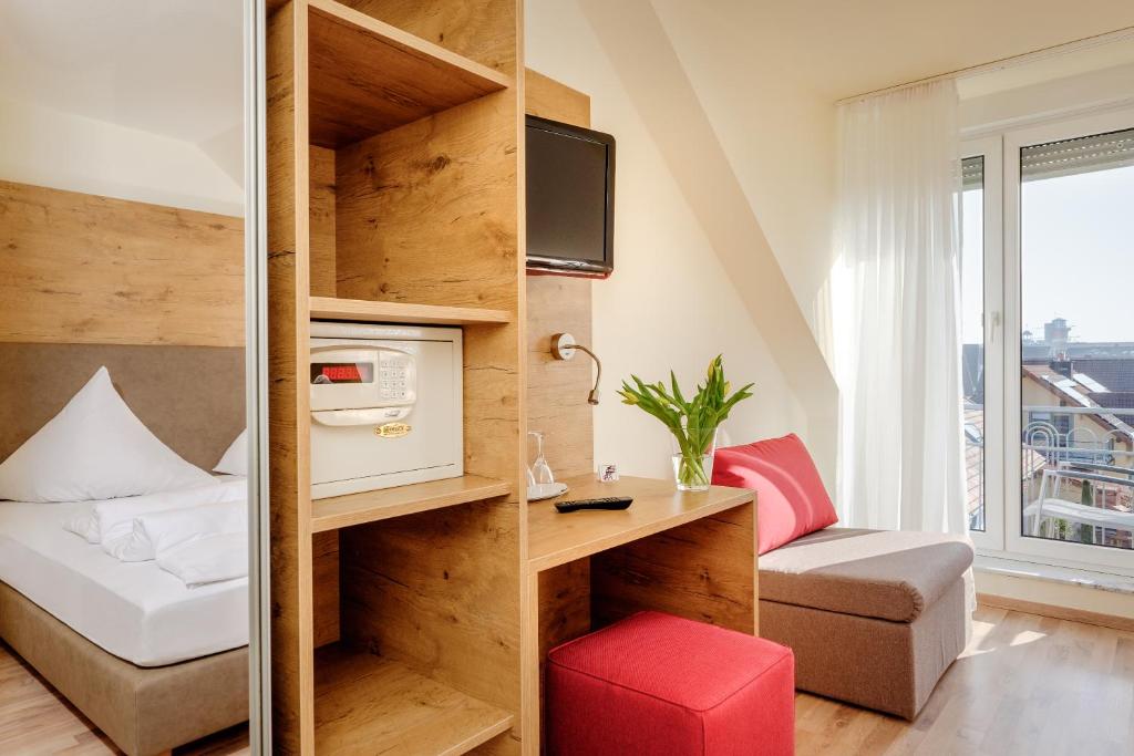 Postel nebo postele na pokoji v ubytování Hotel Mythos