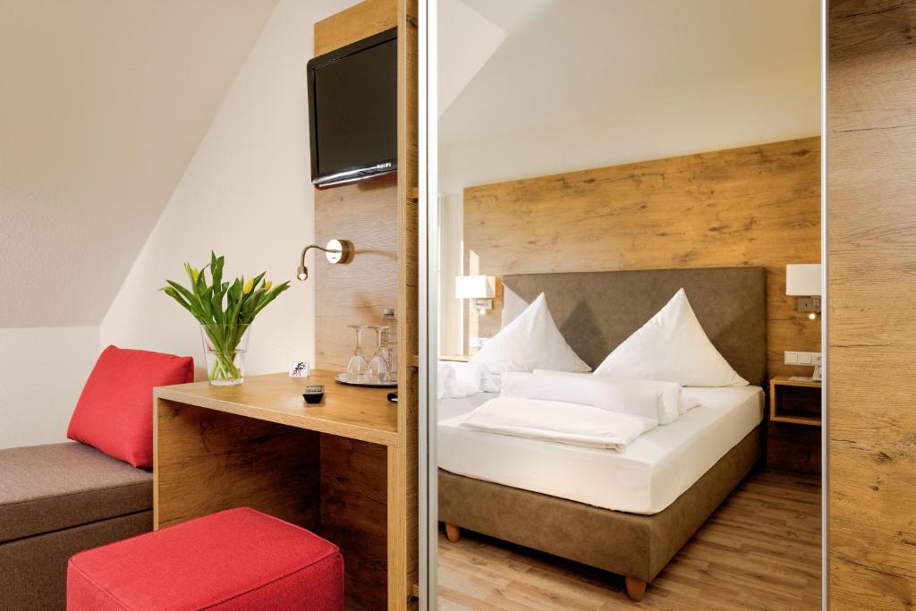 Posteľ alebo postele v izbe v ubytovaní Hotel Mythos