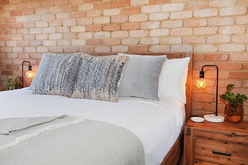 Postel nebo postele na pokoji v ubytování Illawong Apartment 7