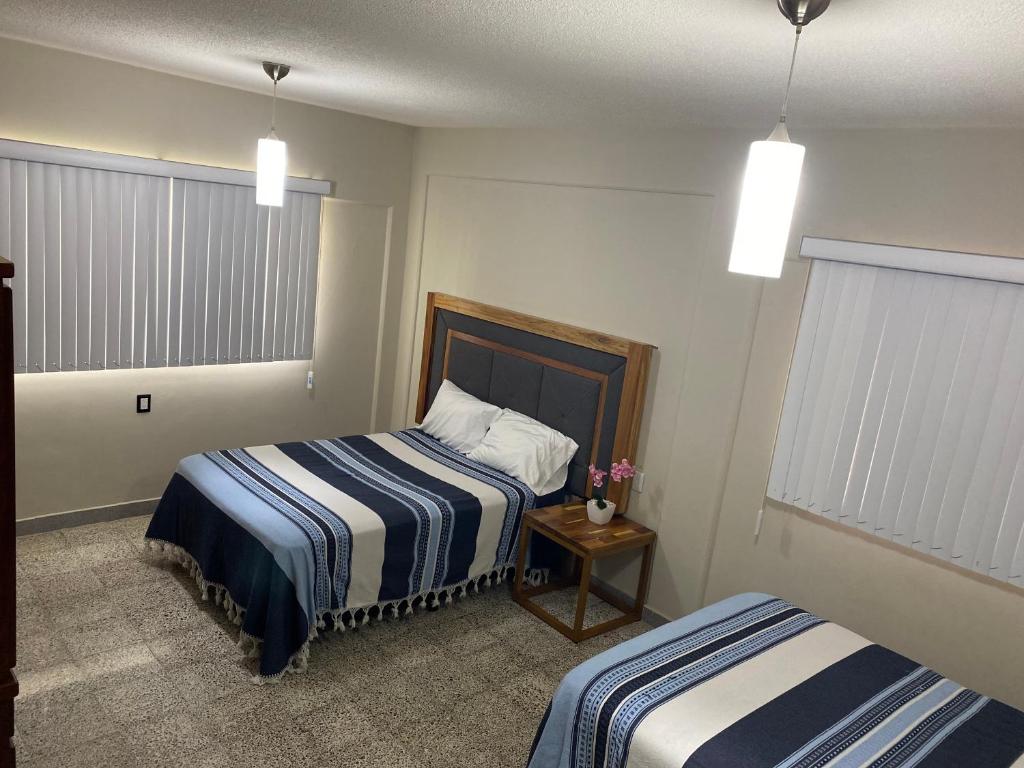 Postel nebo postele na pokoji v ubytování Departamento Runa