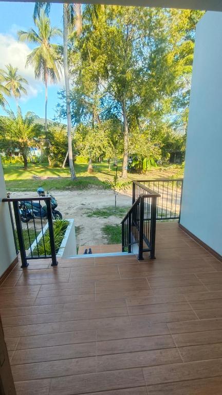 a balcony with a view of a park at 2-Bedroom Maduea Wan House in Ko Phangan