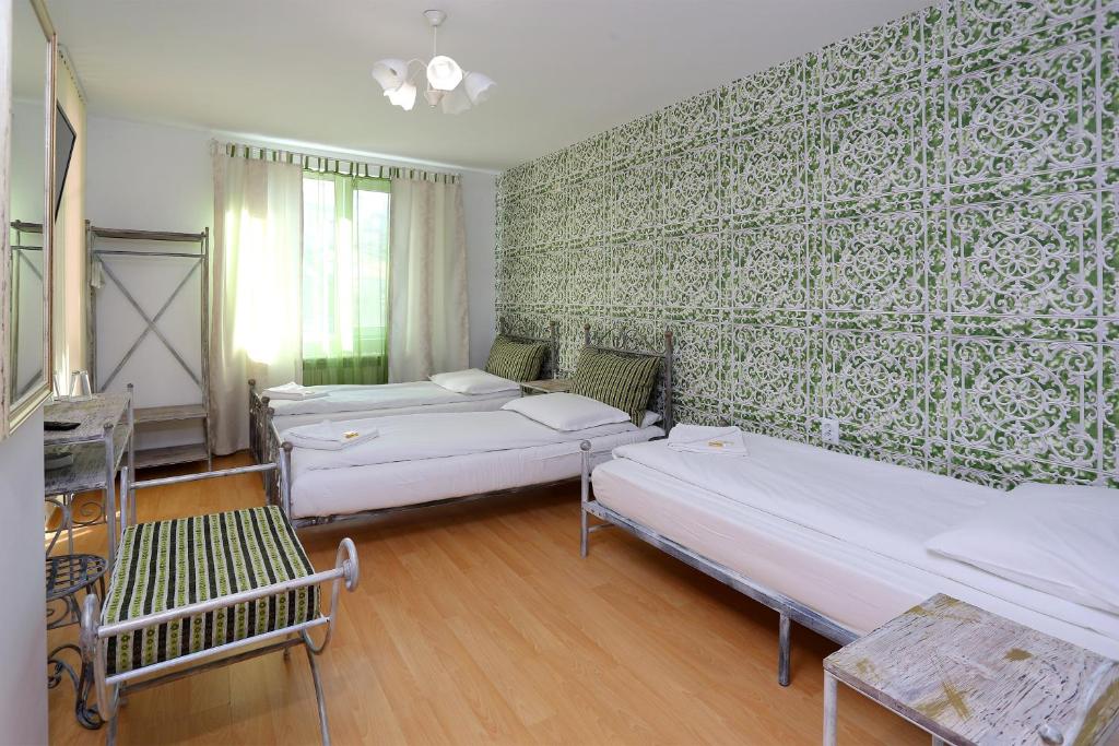 Postel nebo postele na pokoji v ubytování Family Hotel Amor