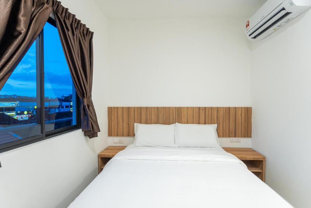 Postel nebo postele na pokoji v ubytování TKT Guesthouse