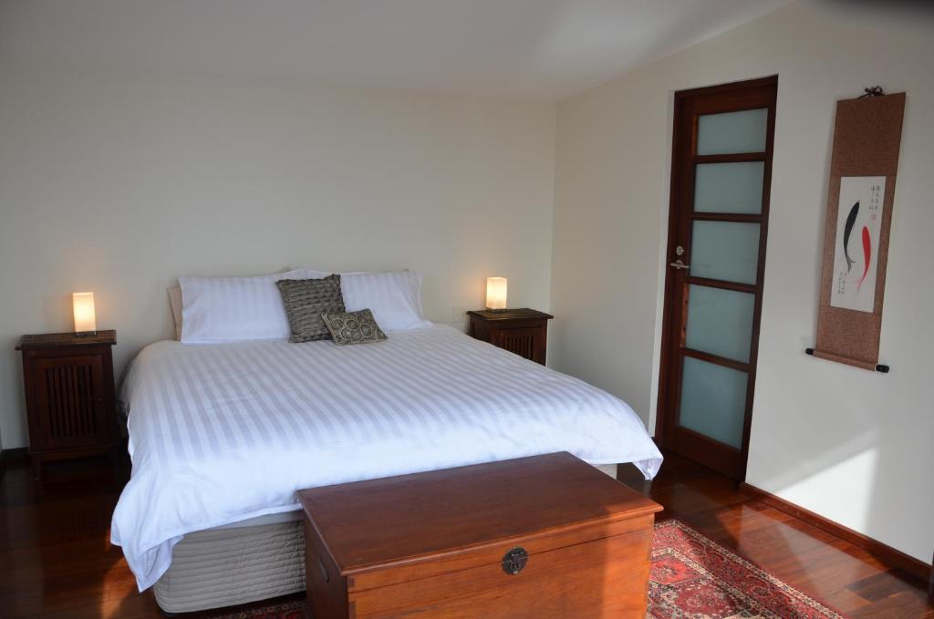 Postel nebo postele na pokoji v ubytování Yolla Beach House