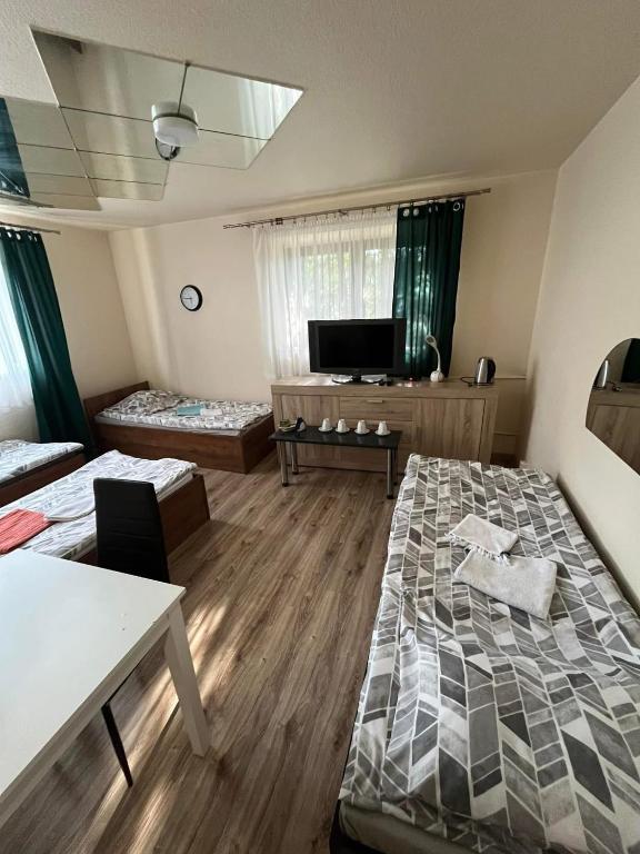 Posteľ alebo postele v izbe v ubytovaní Zajazd Leśny Zakątek dawniej Zajazd Don Kichot