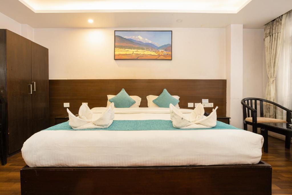 Cama o camas de una habitación en Greatwall International Hotel