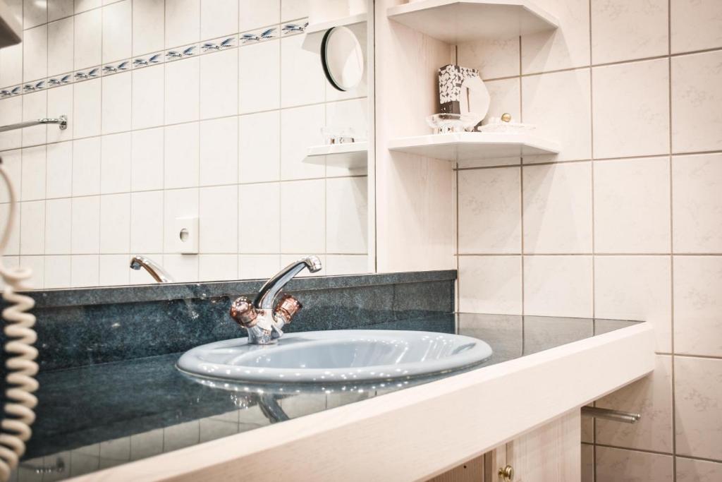 Koupelna v ubytování Berghotel Almrausch