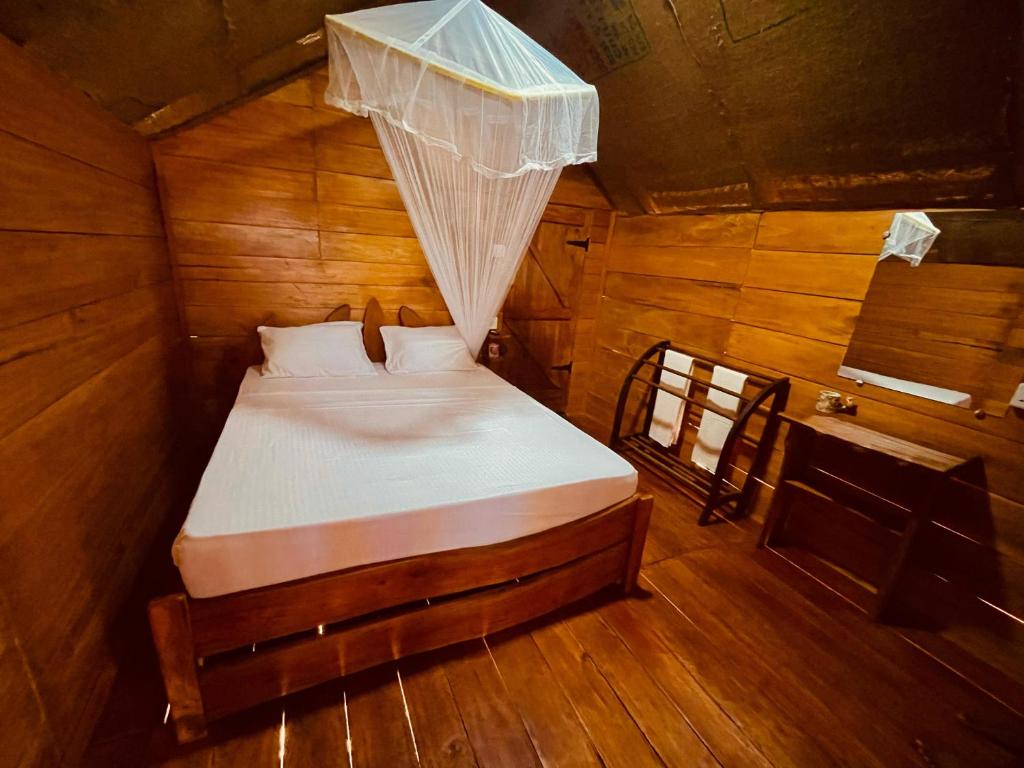 Postel nebo postele na pokoji v ubytování Green land tree house sigiriya