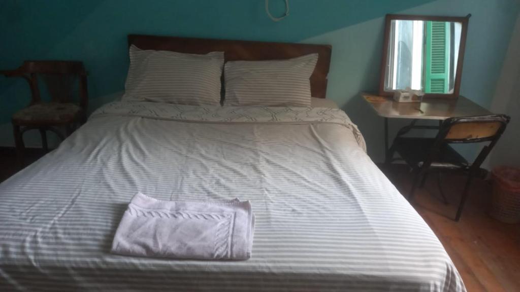Postel nebo postele na pokoji v ubytování Ahllan Hostel For Men onlyغرف خاصة للرجال فقط 仅限男士 女士不允许