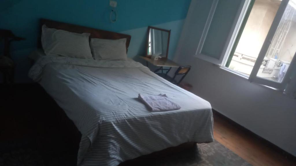 Postel nebo postele na pokoji v ubytování Ahllan Hostel For Men onlyغرف خاصة للرجال فقط 仅限男士 女士不允许