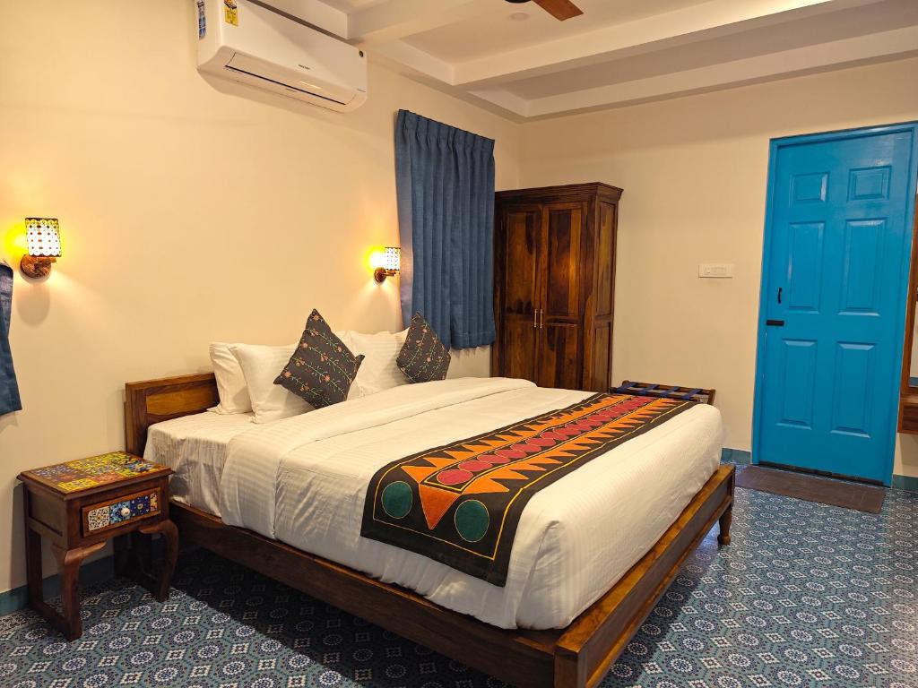 Postel nebo postele na pokoji v ubytování Ibex Resorts, Coimbatore Kakarla