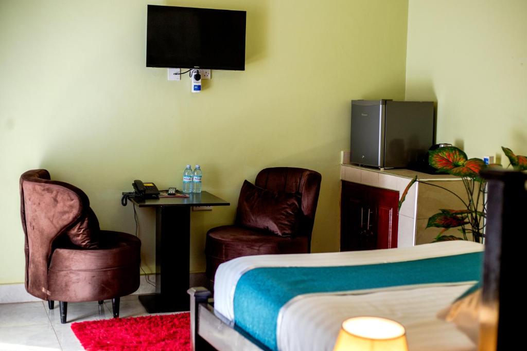 TV a/nebo společenská místnost v ubytování BWIRANDA HOTEL