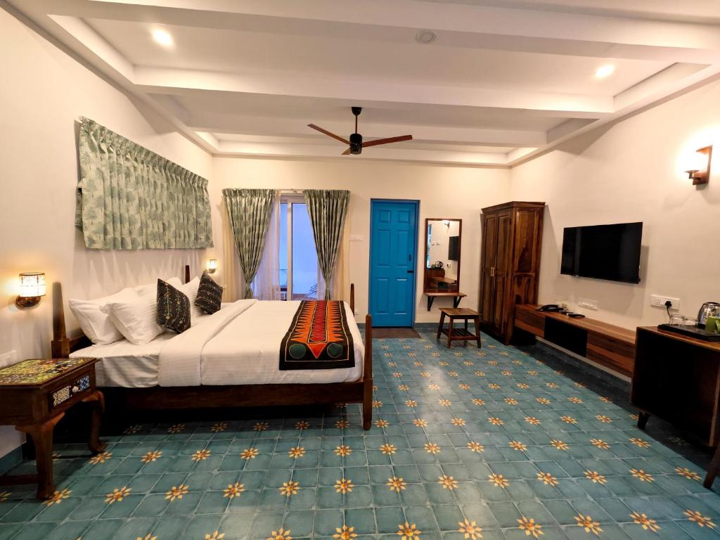 TV a/nebo společenská místnost v ubytování Ibex Resorts, Coimbatore Kakarla