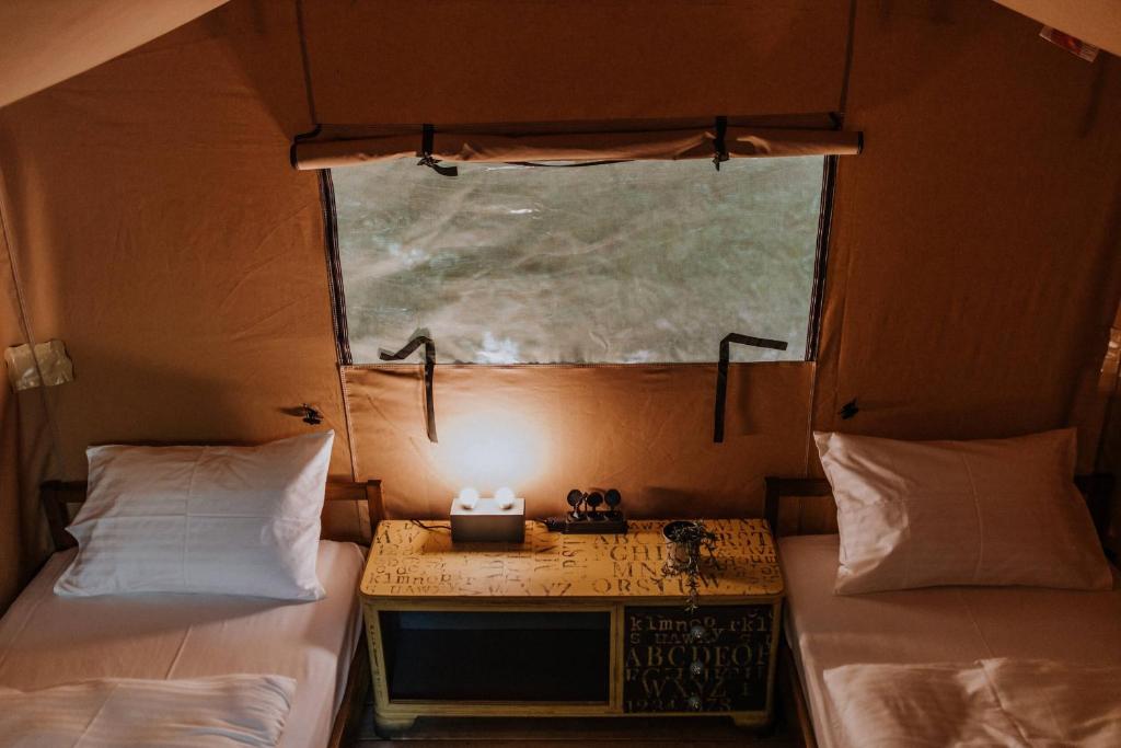 Postel nebo postele na pokoji v ubytování Siocamping Házak Homes