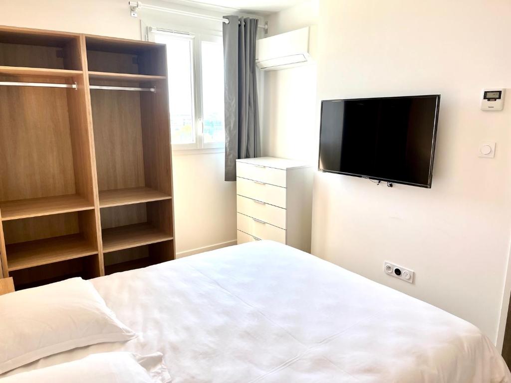 Łóżko lub łóżka w pokoju w obiekcie Résidence Easy Lodge