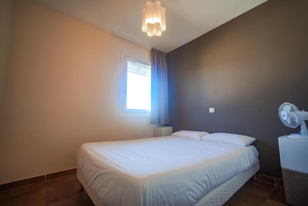Postel nebo postele na pokoji v ubytování Residence Les Chataigniers