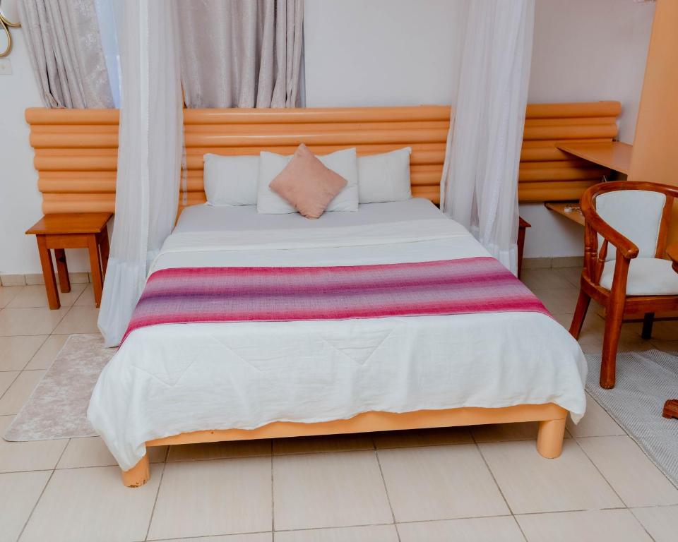Postel nebo postele na pokoji v ubytování Pinebreeze Holiday Resort