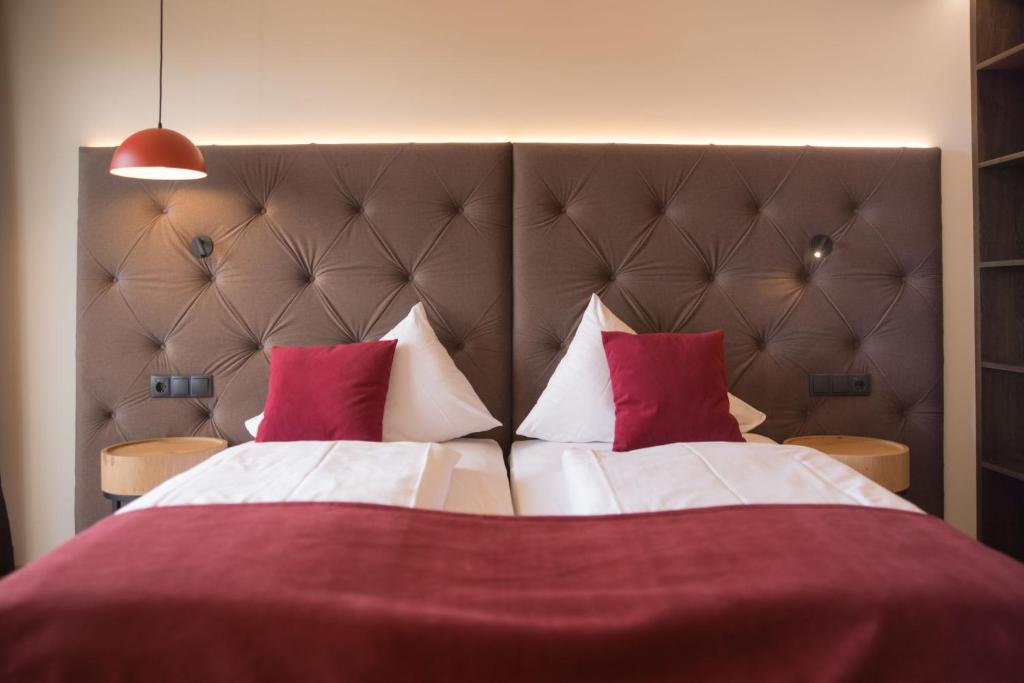 Postel nebo postele na pokoji v ubytování Hotel Haberl - Attersee