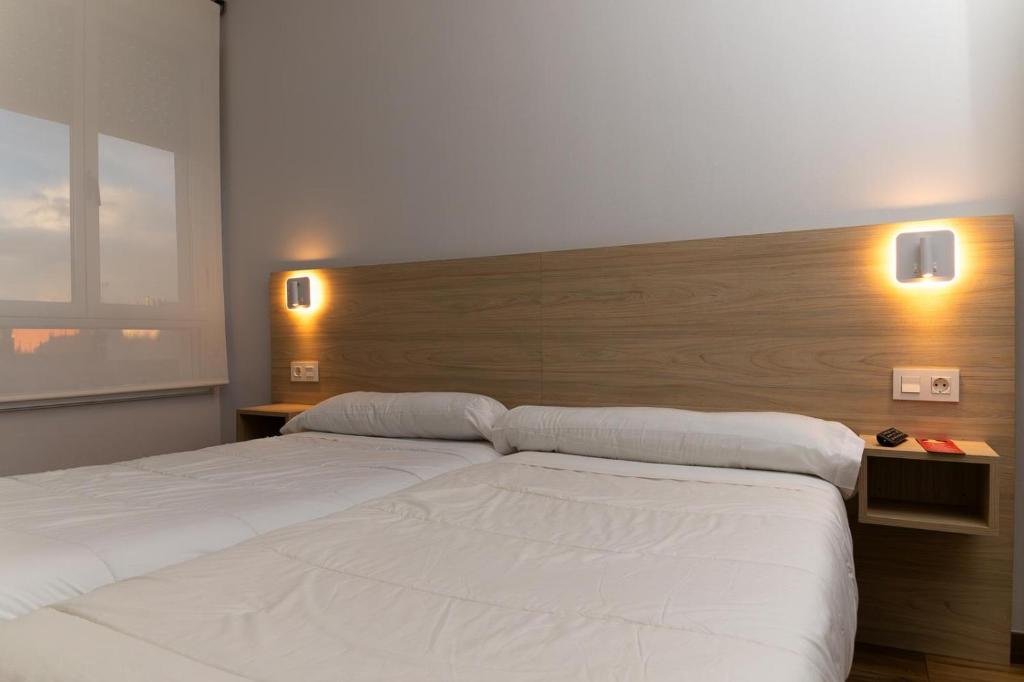 Posteľ alebo postele v izbe v ubytovaní Hostal Restaurante Central