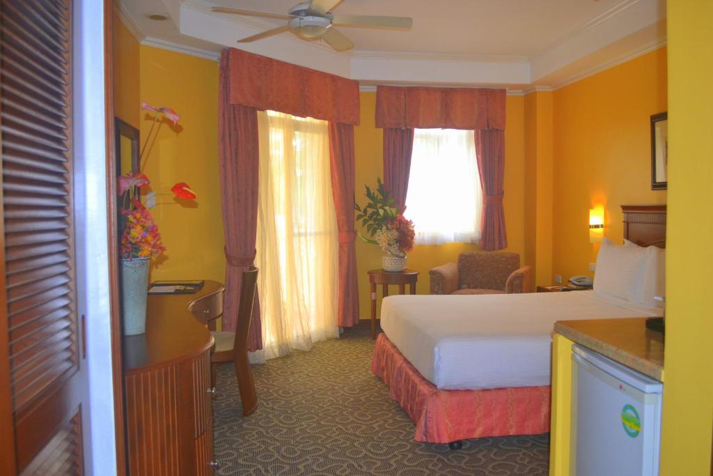 Postel nebo postele na pokoji v ubytování Hotel Elizabeth - Baguio
