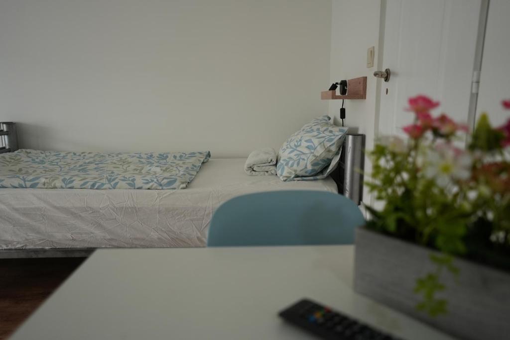 A bed or beds in a room at Center Hostel and Guest House