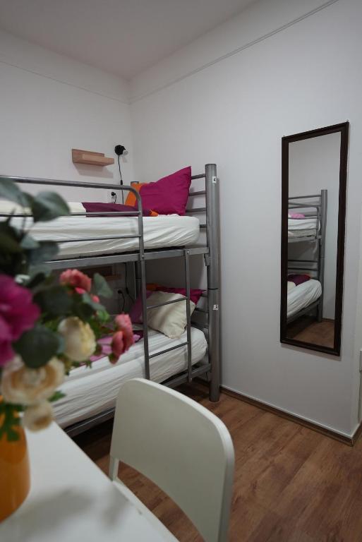 A bed or beds in a room at Center Hostel and Guest House