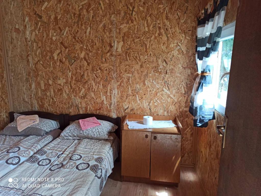 Postel nebo postele na pokoji v ubytování Katun Ljeljenak