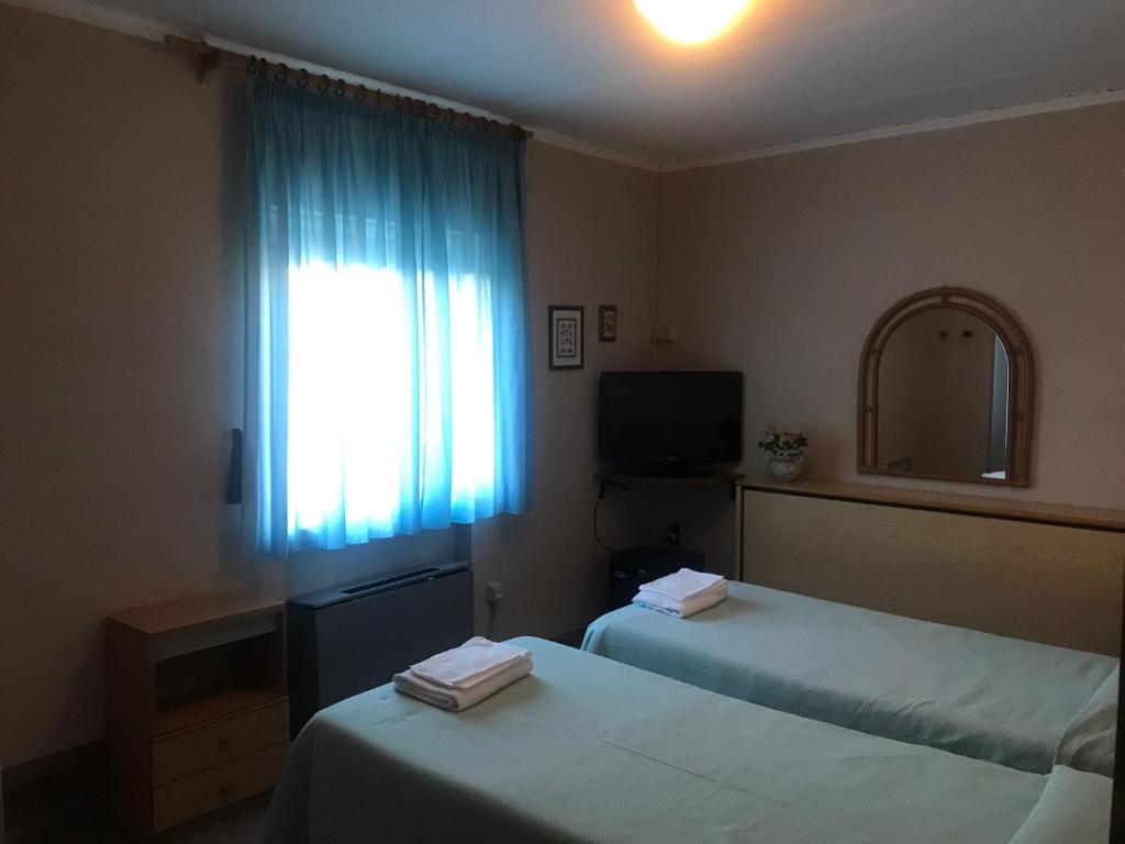 Postel nebo postele na pokoji v ubytování Odec Hotel