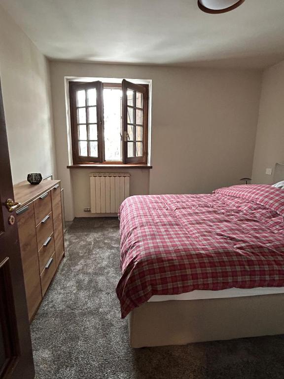 A bed or beds in a room at Ferienhaus-Chalet Breuil-Cervinia Valtournenche