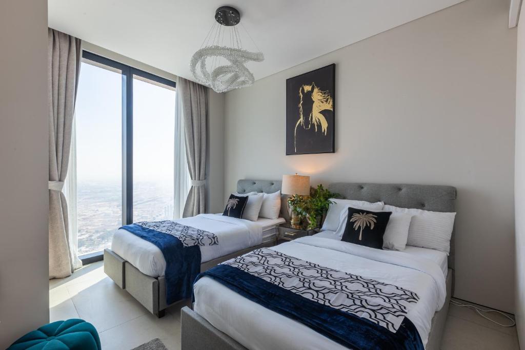 Postel nebo postele na pokoji v ubytování Elegant 2BR Apt Address Beach Resort