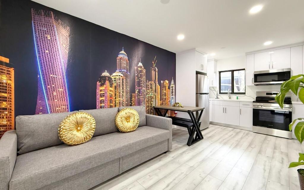 a living room with a couch and a city mural at Modern Oasis near Brickell & Marlins 2 Bedroom Free parking in Miami
