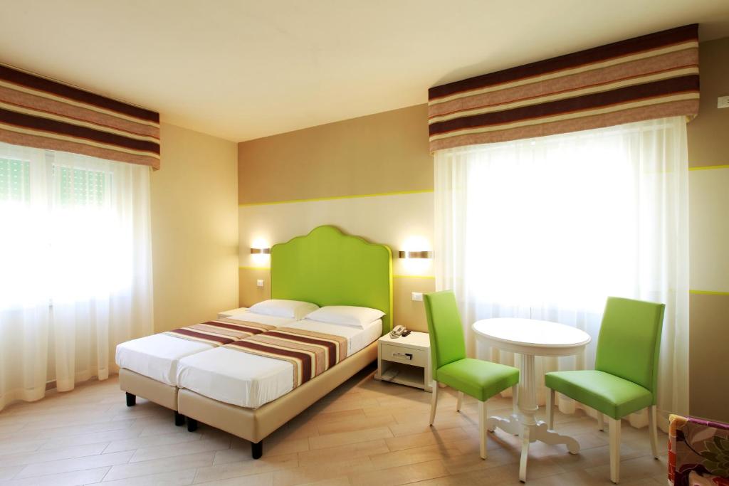 Postel nebo postele na pokoji v ubytování Hotel Souvenir