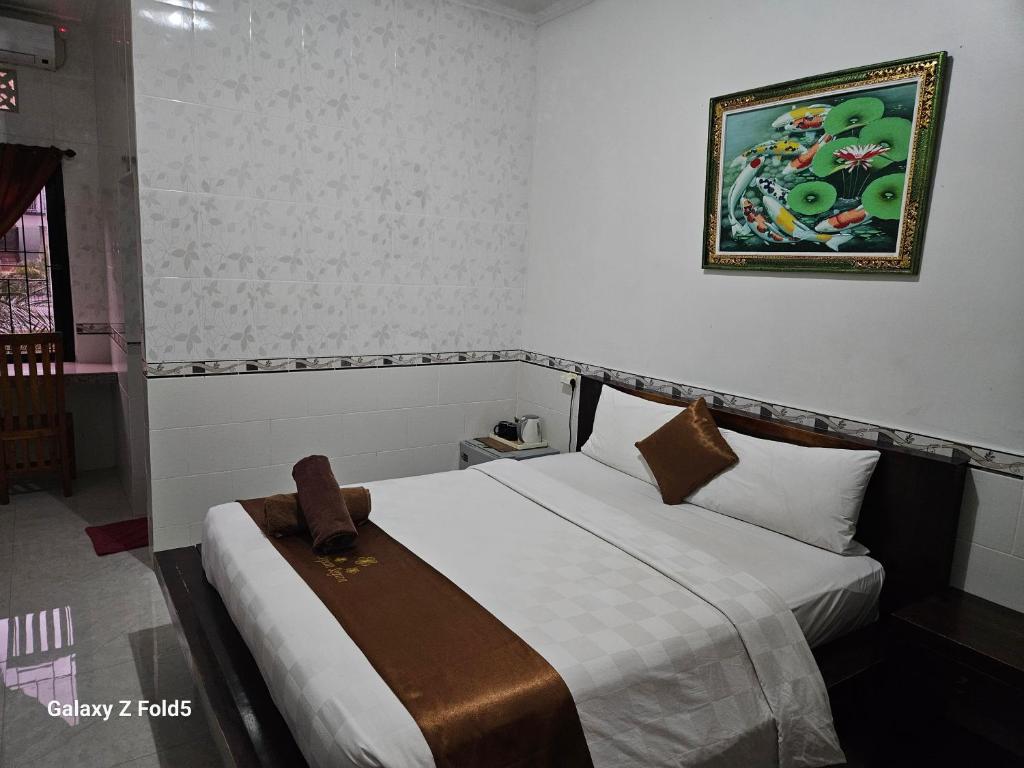 Postel nebo postele na pokoji v ubytování Jepun Segara Guest House
