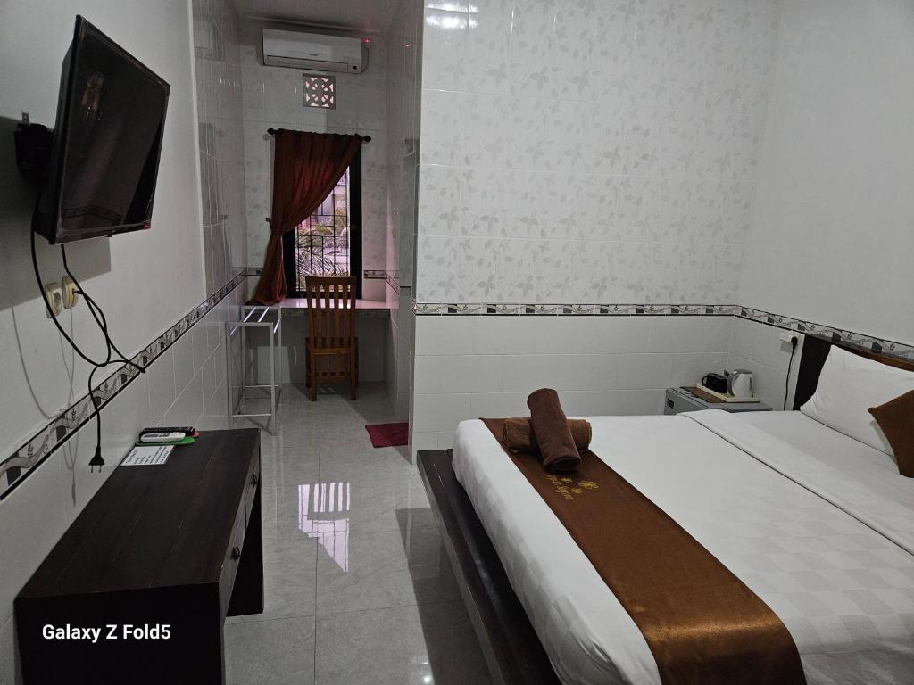 TV a/nebo společenská místnost v ubytování Jepun Segara Guest House