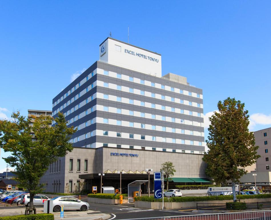 a large building with a sign on the top of it at Matsue Excel Hotel Tokyu in Matsue