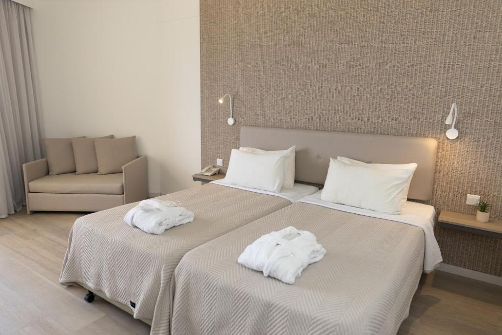 Postel nebo postele na pokoji v ubytování Venus Beach Hotel